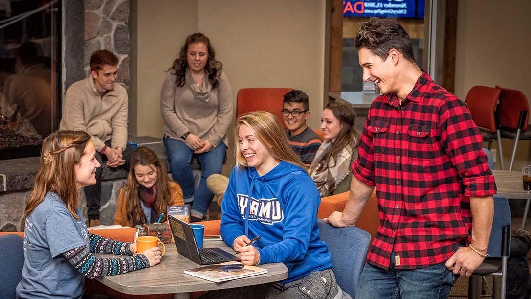 Laughing students in the Crow’s Nest Campus Restaurant 